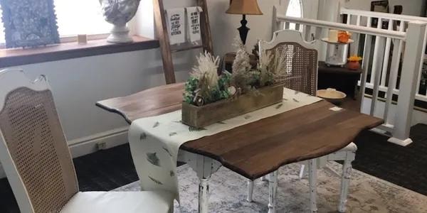 Farmhouse dining table with cane chairs and seasonal centerpiece